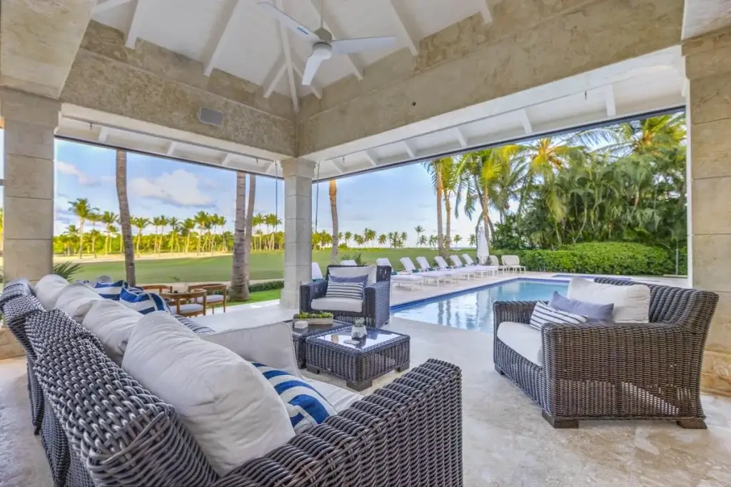 Covered terrace and pool at Tortuga Bay D8, Punta Cana, illustrating Dominican Republic luxury villas with private outdoor living.