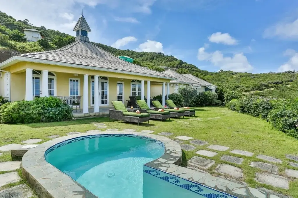 Rainforest-set Equinox, St Lucia with a private pool, covered terrace, and hillside surroundings, reflecting St. Lucia luxury villas.