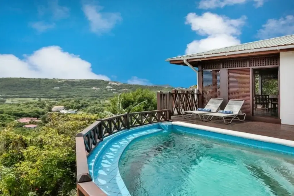 Private pool terrace at Orchid Cottage, St Lucia, set above lush hillsides and reflecting the appeal of St. Lucia luxury villas.