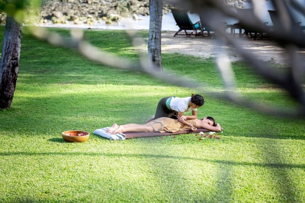 Outdoor garden massage at Ban Sairee villa highlighting wellness-focused Thailand luxury travel