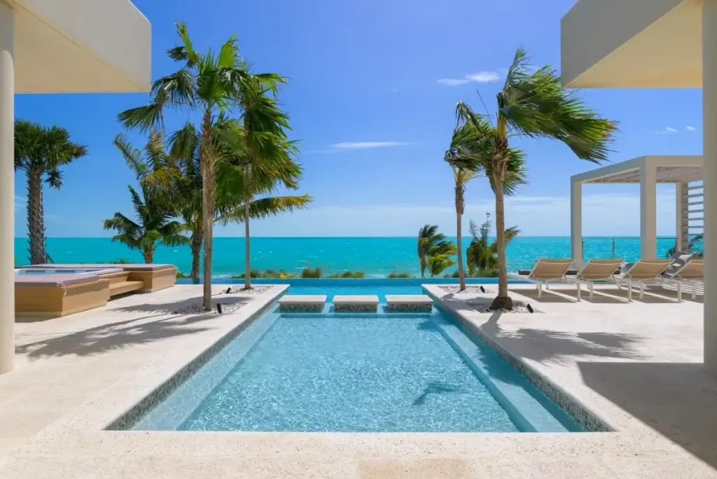 Infinity pool and oceanfront terrace at Villa Kailoa, a spring break private villa without the crowds in Turks & Caicos.