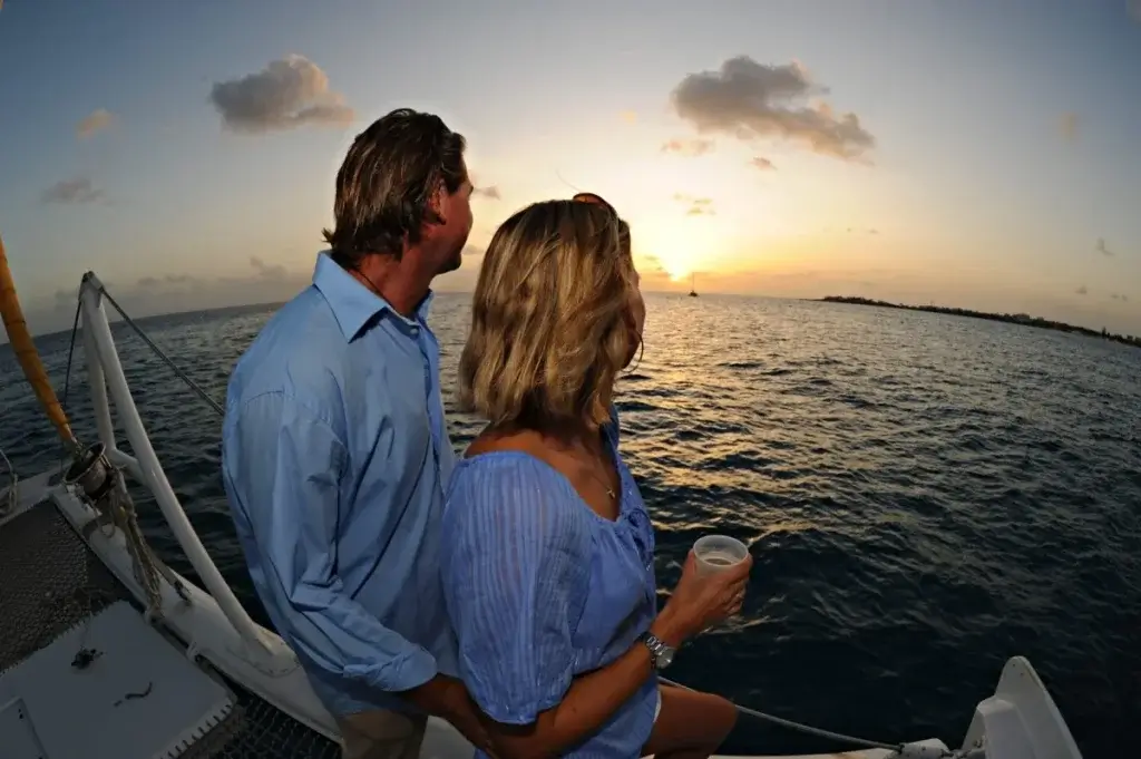 Guests enjoying the Bubbly Sunset Cruise in St Martin during a seamless St Martin stay aboard a luxury catamaran.