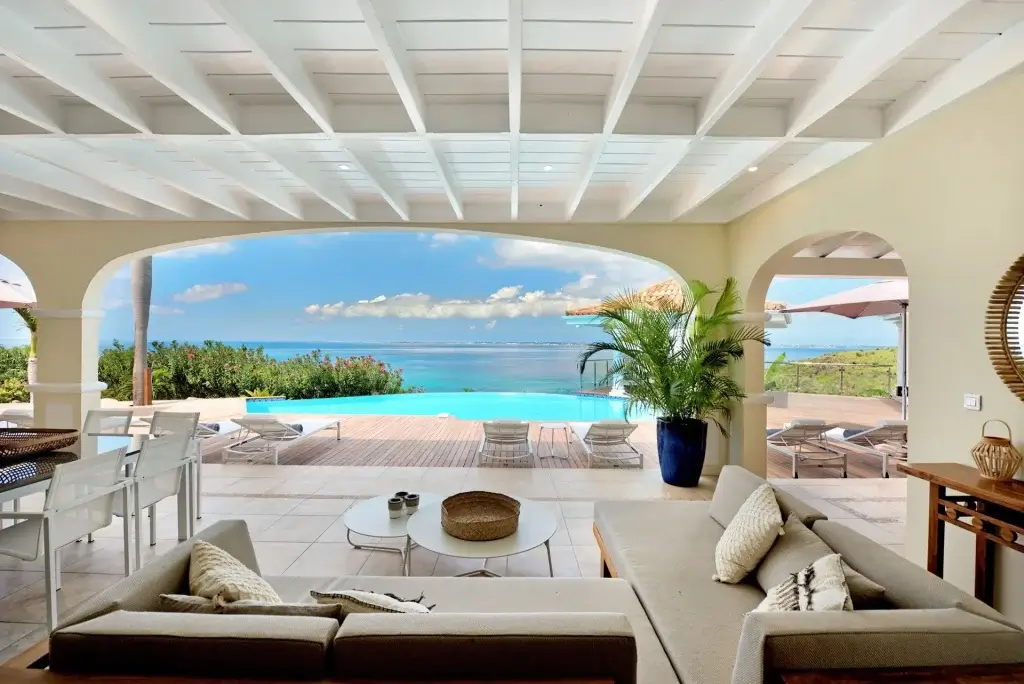 Villa Happy Bay open-air terrace and infinity pool during St Martin Carnival April
