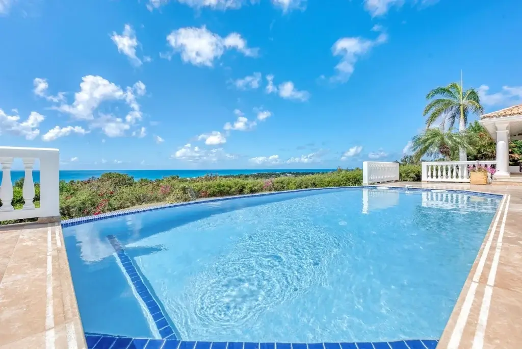 Villa Mer Soleil curved infinity pool with panoramic Caribbean views