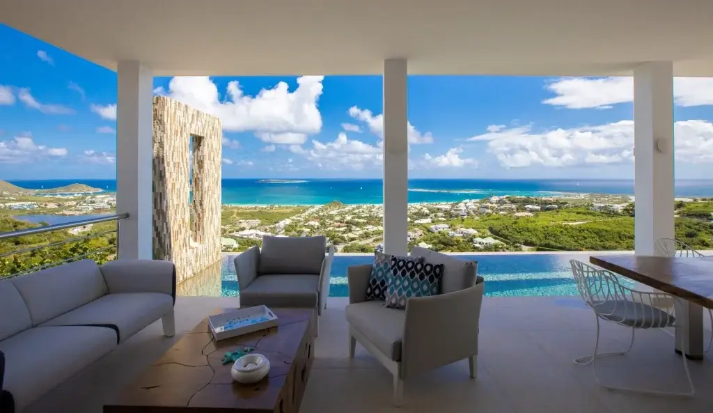Villa Sunrise terrace and infinity pool overlooking the coast during St Martin Carnival April