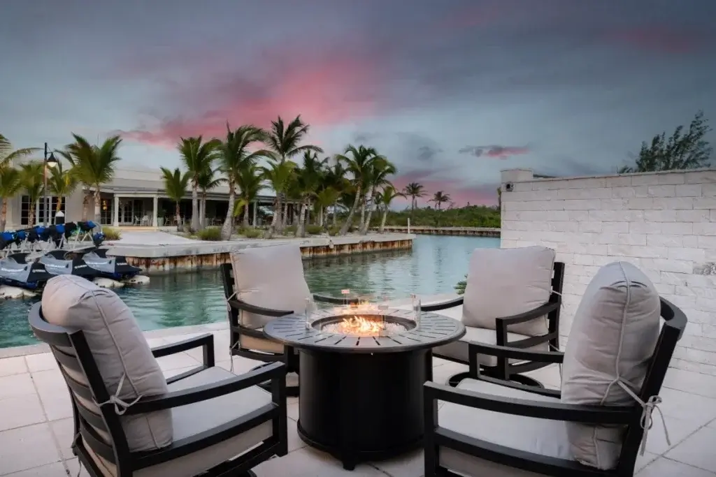 Marina-side fire pit lounge at Sugar Apple Turks and Caicos family villas with private dock access