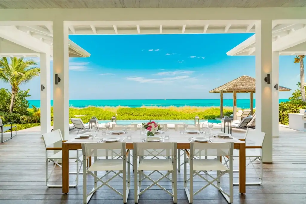 Oceanview alfresco dining terrace at Frangipani Turks and Caicos family villas with private pool access