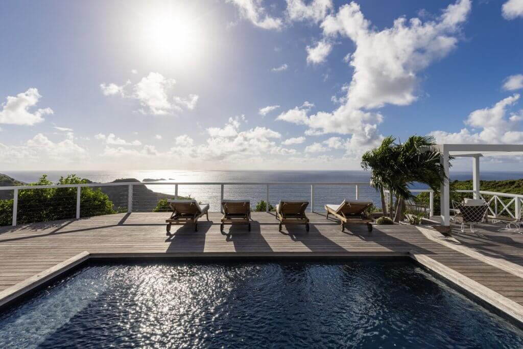 Memorial Day travel at Villa Oceane, St Barts with beachfront pool, loungers, palms, and turquoise sea views