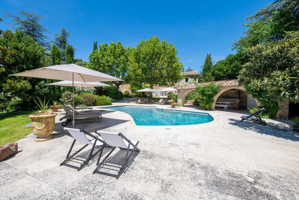 Mas des Joies with private pool, gardens, stone terraces, and shaded lounging areas