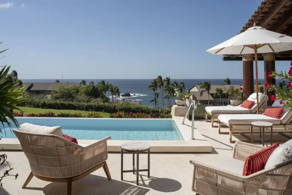 Memorial Day travel at Villa Amara, Punta Mita with infinity pool, ocean views, loungers, and shaded terrace
