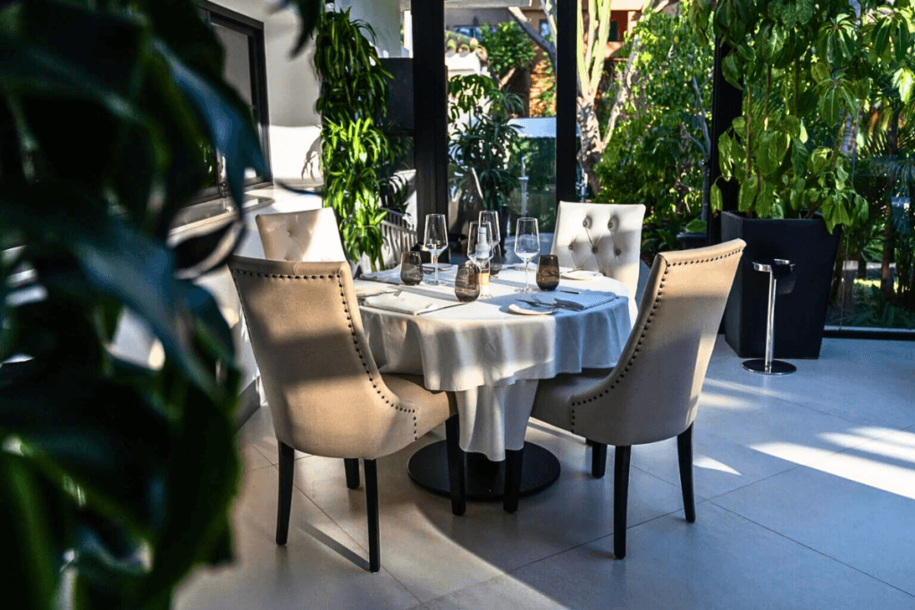 Elegant Mediterranean restaurant interior with garden surroundings