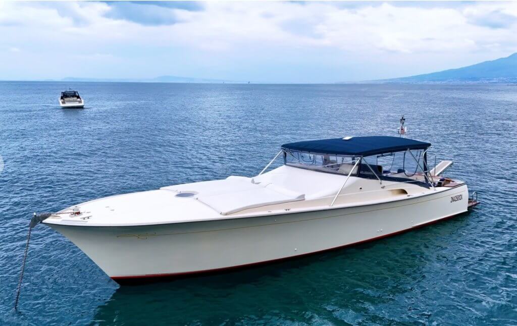 Private boat with cushioned sun deck for a luxury Amalfi Coast experience