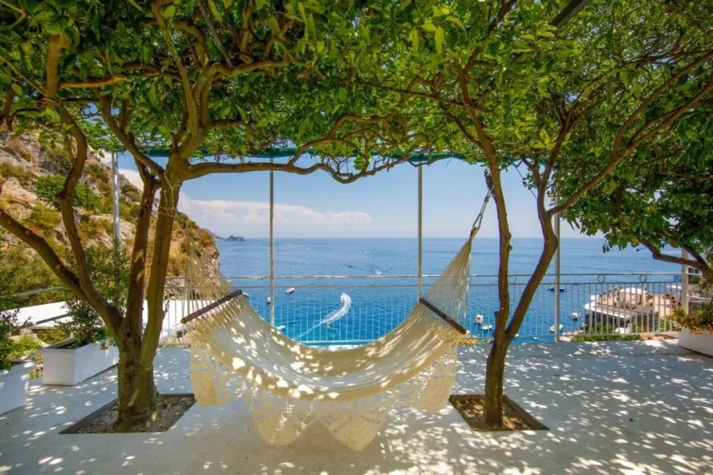 Don Pietro terrace with hammock, lemon trees, sea views, and shaded outdoor seating