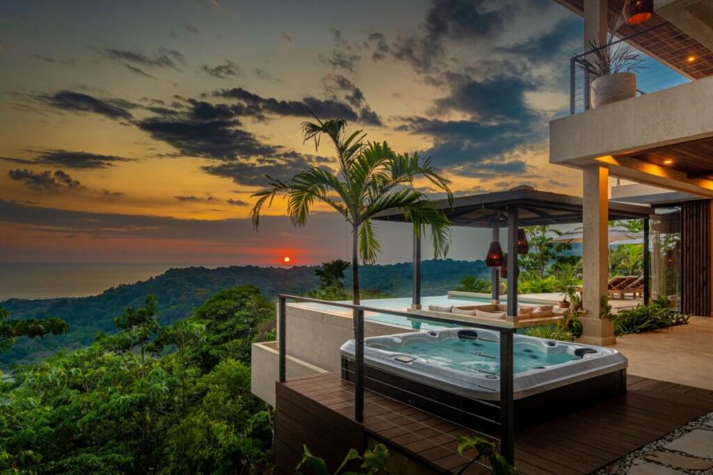 Casa Riverstone Costa Rica sunset terrace with private hot tub and panoramic jungle-to-ocean views