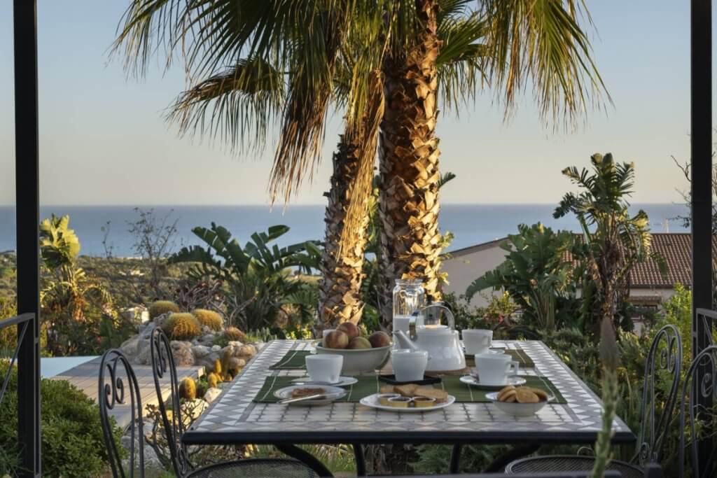 Luxury Sicily Villas terrace dining at Casa Alba - Sicily with Mediterranean views and tropical gardens