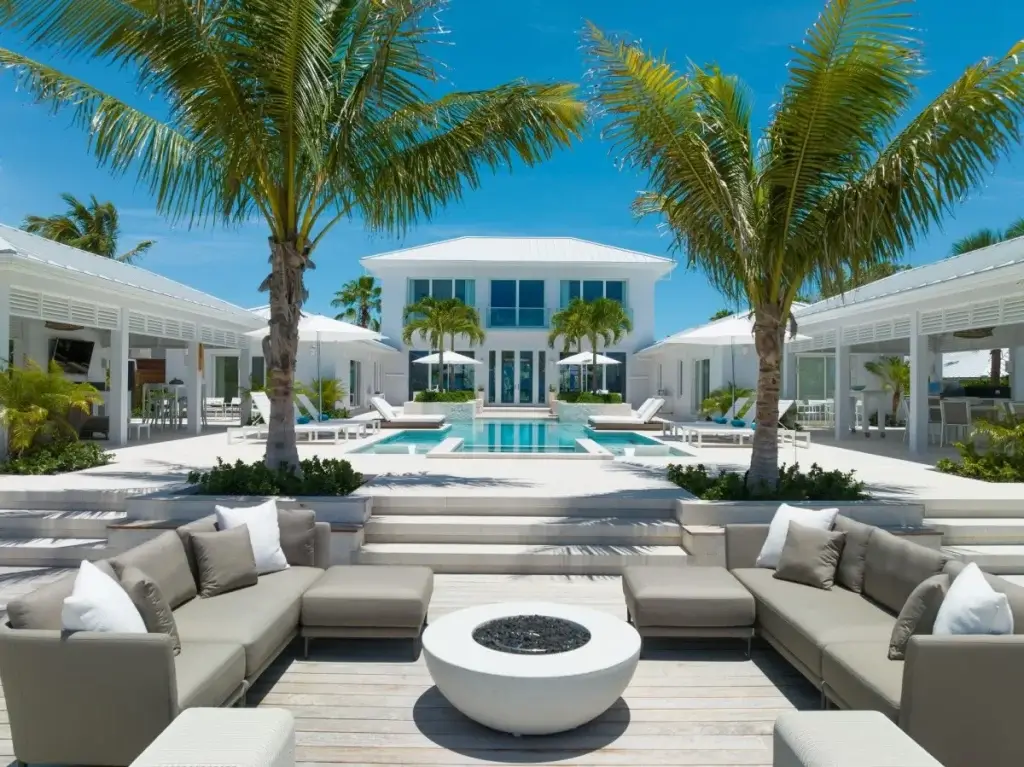Luxury beachfront outdoor lounge with fire pit at Villa Milestone, one of the best luxury villas in Turks and Caicos