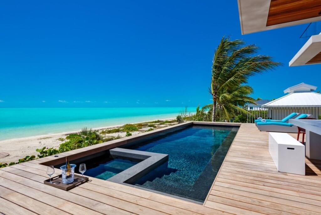 Umi’s private pool and oceanfront terrace among luxury villas in Turks and Caicos on Long Bay Beach.
