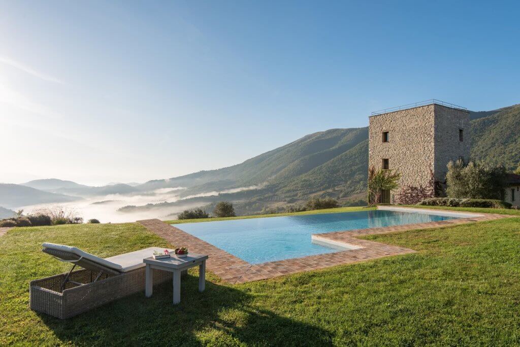 Torre in Umbria with an infinity pool and stone tower in one of the best places to visit in Italy.