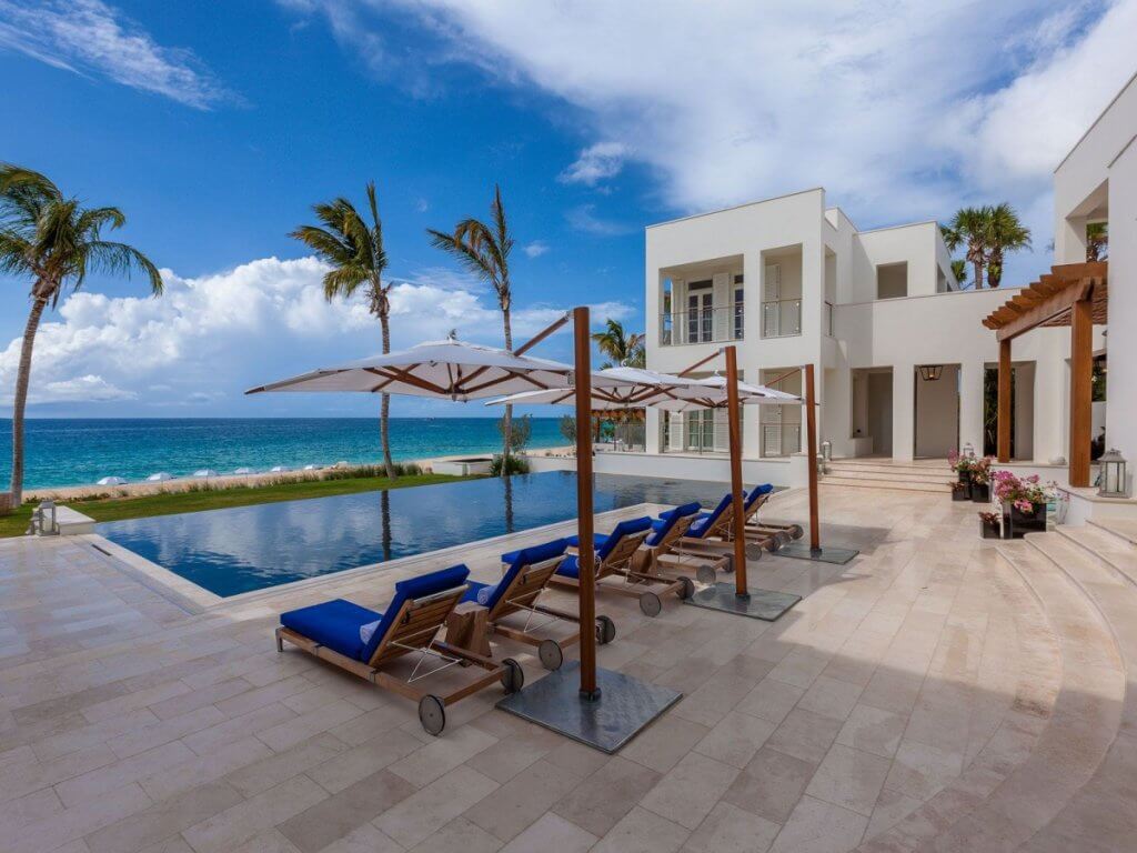 Cerulean’s oceanfront pool and shaded loungers frame the sea for travelers choosing where to stay in Anguilla.