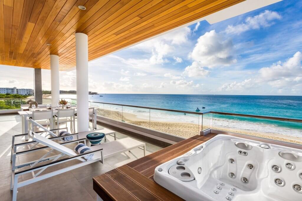 Private hot tub, shaded dining terrace and loungers overlooking Meads Bay at Tranquility Beach 2BR.