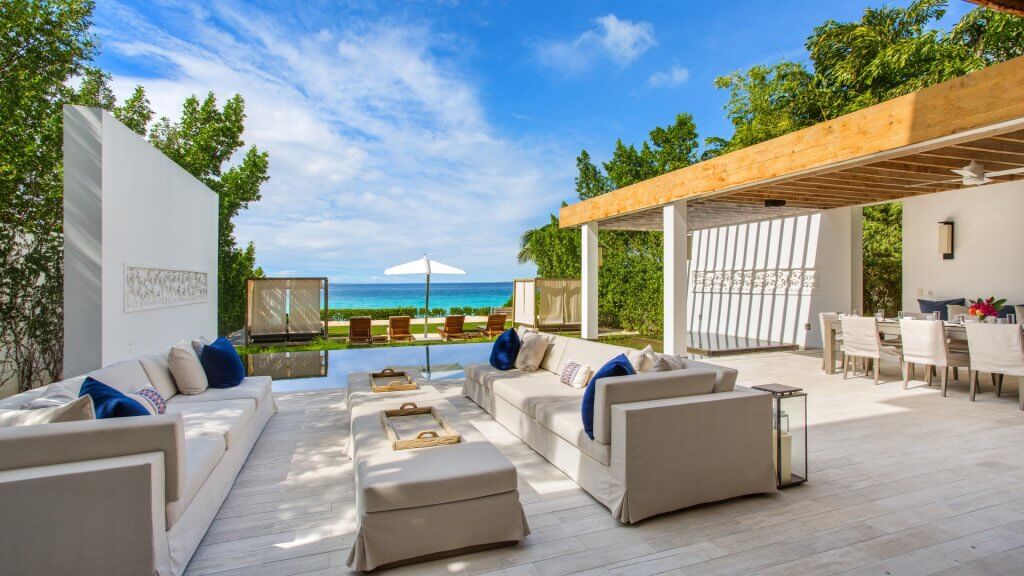 Kishti East’s open-air lounge and pool overlook Meads Bay for travelers choosing where to stay in Anguilla.