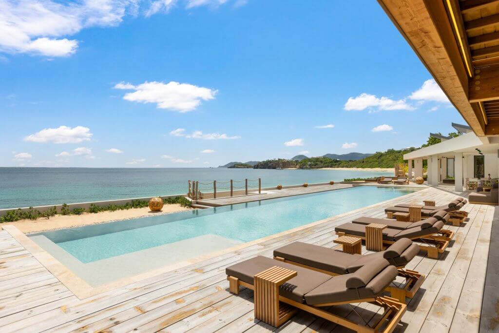 Atabeya’s private beachfront lap pool and timber terrace overlooking Baie Rouge.