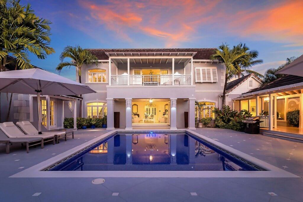 Tradewinds, one of the best Caribbean villas, with a private pool and open-air terraces at sunset.