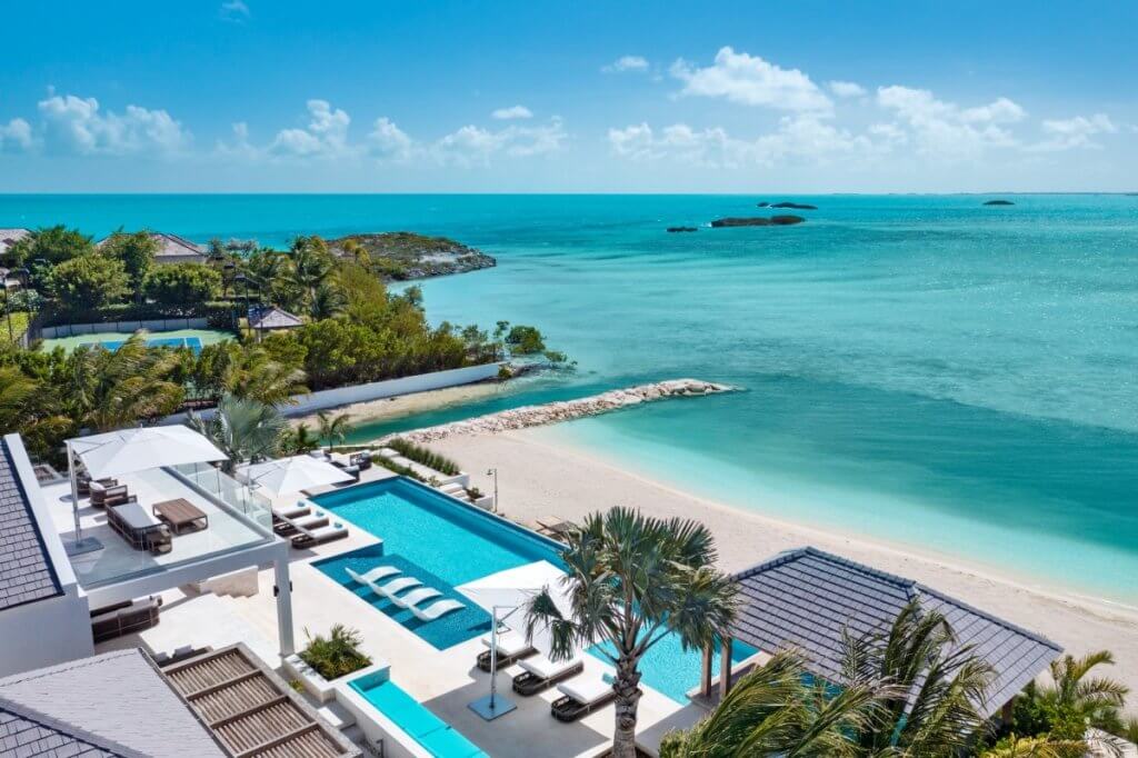 Emerald Bay, one of the best Caribbean villas, with an infinity pool overlooking a turquoise cove.